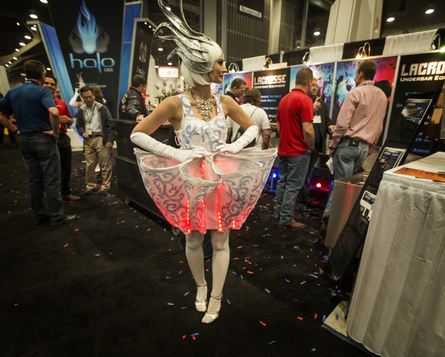 Model Ashley (declined to give last name) wears a LED cupcake dress at the Nightclub & Bar Convention & Trade Show in the Las Vegas Convention Center on Tuesday,  March 8, 2016. Jeff Schei ...