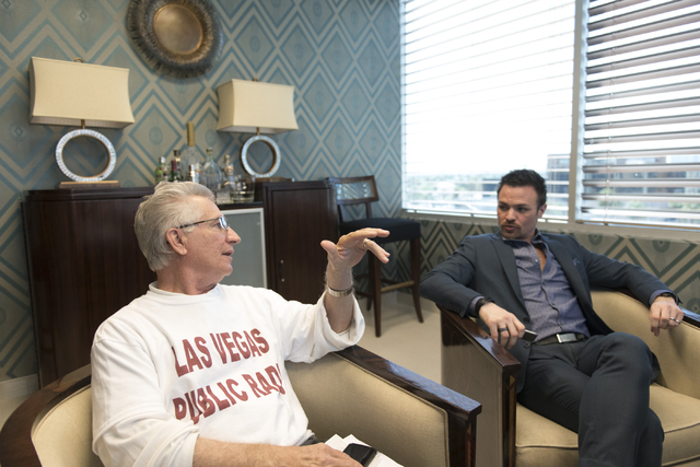 Andrew LaPorta, vice president of Magic KIOF 97.9 FM, left, and Attorney Michael Pandullo talk in Pandullo's office, down the hall from the Magic office at 400 S. 4th St. Suite 500 in Las Vegas Fr ...