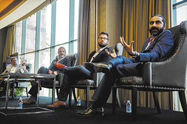 Senior Vice President of Sales for Cvent Bharet Malhotra, right, speaks during an educational panel event discussing technology trends in hospitality from the MGM Grand conference center in Las Ve ...