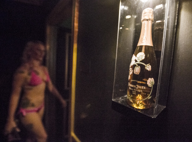 Daisy, her stage name, walks into one of the champagne themed rooms at Sapphire Gentleman's Club, 3025 Sammy Davis Jr. Drive on Friday, Feb. 26, 2016. Jeff Scheid/Las Vegas Review-Journal Follow ...