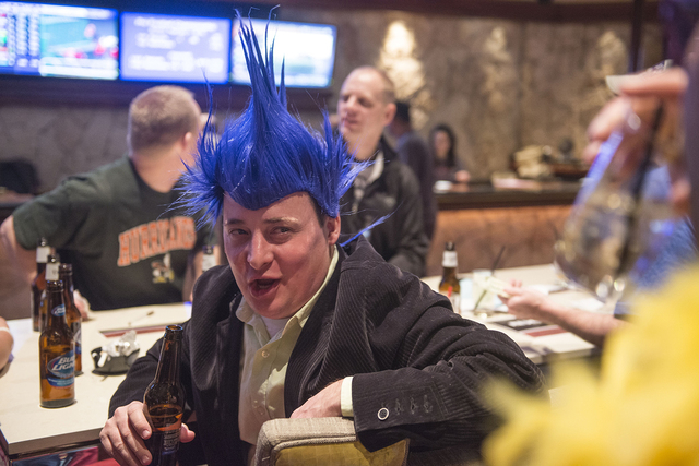 Bernard Bennett from Iowa talks to his friends at the sports book in the Mirage in Las Vegas on Saturday, Jan. 31, 2015. Bennett and his friends have traveled to Las Vegas for the past 15 years fo ...
