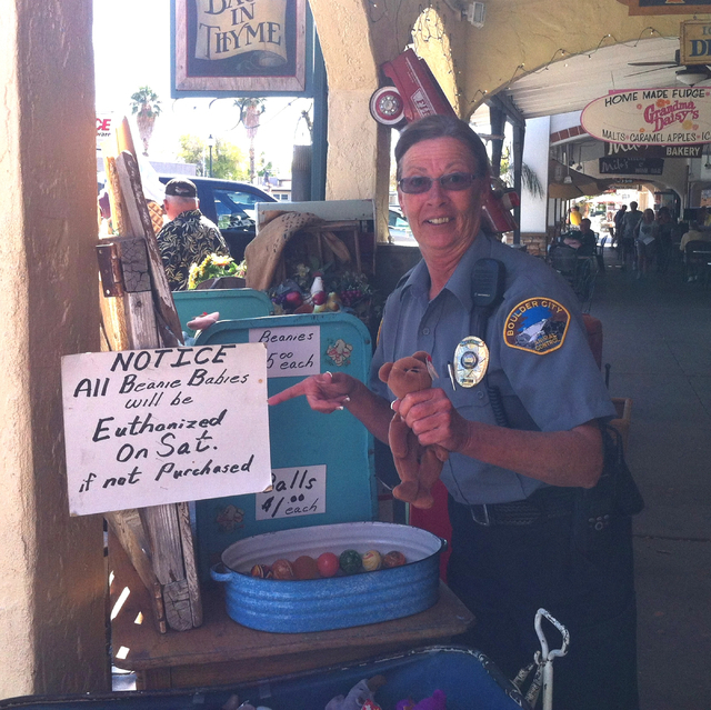 Former Boulder City Animal Control Supervisor Mary Jo Frazier poses after asking to have her photo taken with a store display outside a Boulder City business. Courtesy photo
