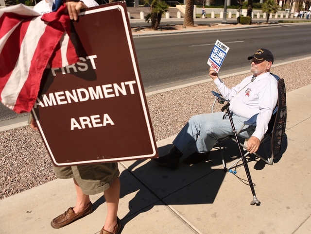 Mesquite resident Robert Deihl demonstrates in his chair outside the Lloyd George Federal Building on Thursday, March 10, 2016, in Las Vegas. (Jeff Scheid/Las Vegas Review-Journal)