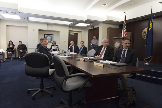 Brian Gaumer, director of test and development engineering with Hyperloop Technologies, right, speaks with Gov. Brian Sandoval in Carson City via teleconference during a board meeting at the Gover ...