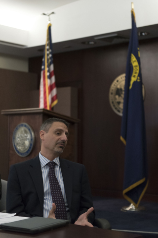 Brian Gaumer, director of test and development engineering with Hyperloop Technologies, speaks with Gov. Brian Sandoval in Carson City via teleconference during a board meeting at the Governor's O ...