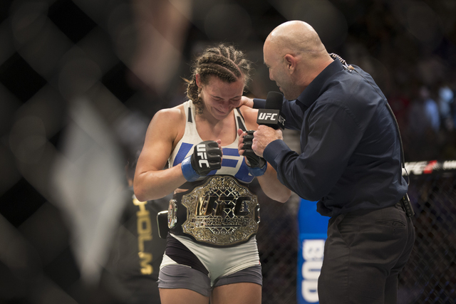 Miesha Tate, left, reacts to her victory against Holly Holm by way of submission in their women’s bantamweight title bout during UFC 196 at MGM Grand Garden ArenaSaturday, March 5, 2016, in ...