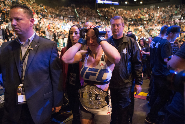 Miesha Tate reacts to her victory against Holly Holm by way of submission in their women’s bantamweight title bout during UFC 196 at MGM Grand Garden ArenaSaturday, March 5, 2016, in Las Ve ...