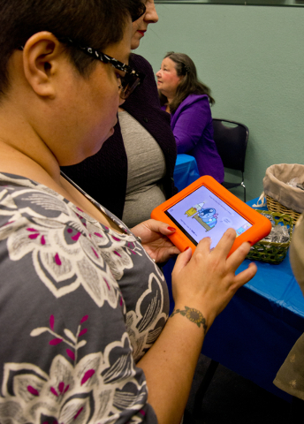 Kristine Segura interacts with a new Playaway Launchpad at the Green Valley Library March 1. Daniel Clark/View