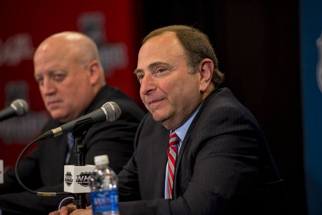 NHL Commissioner, Gary Bettman, addresses media, along side Bill Daly, NHL Deputy Commissioner, during a news conference at the MGM Grand Garden Arena in Las Vegas on Wednesday, June 24, 2015. (Jo ...