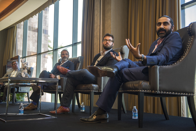 Senior Vice President of Sales for Cvent Bharet Malhotra, right, speaks during an educational panel event discussing technology trends in hospitality from the MGM Grand conference center in Las Ve ...