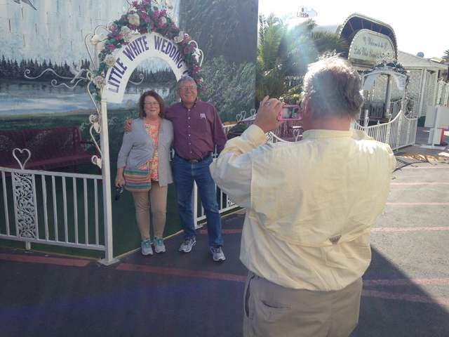 Pink Jeep tour guide Richard Evans photographs Gary Hafernick and Peggy Hafernick in front of the Little White Chapel on Tuesday, March 8, 2016. Kimberly De La Cruz/Las Vegas Review-Journal