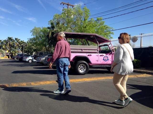 Gary and Peggy Hafernick walk back to their Pink Jeep tour after seeing the Little White Wedding Chapel on Wednesday, March 8, 2016. Kimberly De La Cruz/Las Vegas Review-Journal