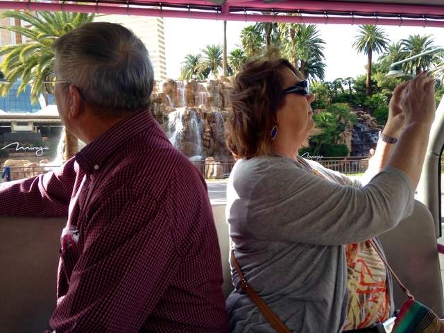 Gary and Peggy Hafernick stop to photograph sites on the Strip during a Pink Jeep tour on Wednesday, March 8, 2016.