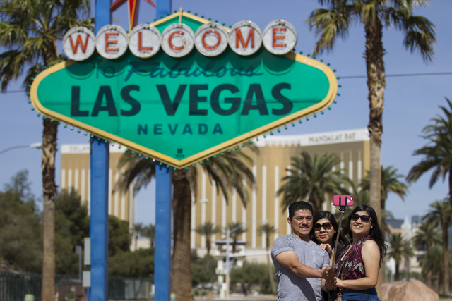 Alfredo Sanchez, from left, with his wife and daughter both named Rosalba, tourists visiting from San Diego, pose in front of the Welcome to Fabulous Las Vegas sign on Tuesday, March 15, 2016, in  ...