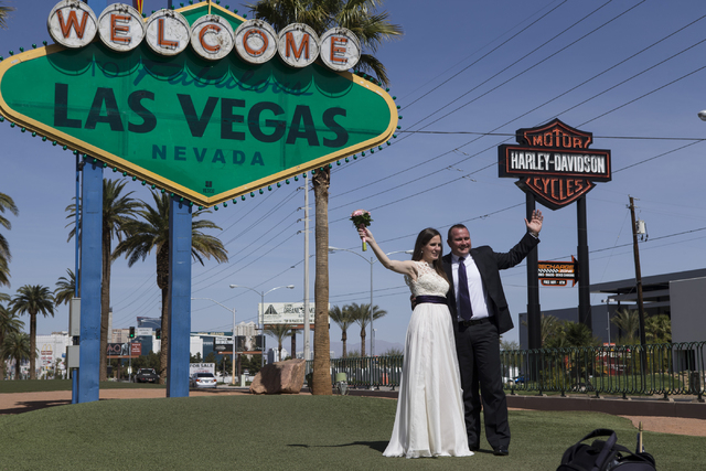 Newlyweds Andrea Samu, left, and her husband Laszlo Kondor, pose in front of the Welcome to Fabulous Las Vegas sign on Tuesday, March 15, 2016, in Las Vegas. Erik Verduzco/Las Vegas Review-Journal ...