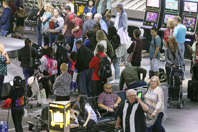 People congregate at baggage claim at McCarran International Airport Wednesday, March 23, 2016, in Las Vegas. Ronda Churchill/Las Vegas Review-Journal