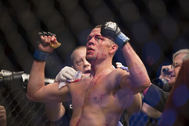 Nate Diaz celebrates his win against Conor McGregor in their menճ welterweight bout during UFC 196 at MGM Grand Garden Arena on Saturday, March 5, 2015 in Las Vegas. Diaz won by way of submission ...