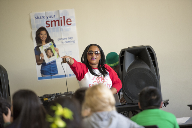 Elizabeth Elie, who goes by the name Lizzie G, performs at Quest Preparatory Academy March 17. Joshua Dahl/View