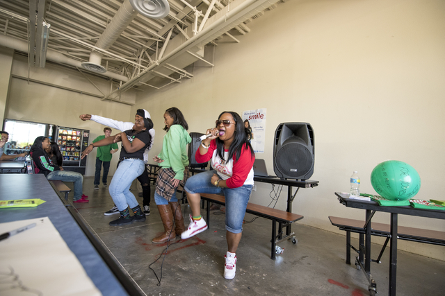 Elizabeth Elie, who goes by the name Lizzie G, performs at Quest Preparatory Academy March 17. Joshua Dahl/View