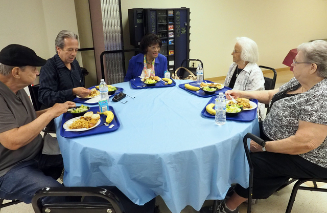 A group of seniors sit down for lunch at the Holy Spirit Lutheran Church March 2. Seated from left are John McNown, 79; Abraham Amaya, 62; Ruby Collins, 86; Ilene Greenwald, 94; and Mable Hooper,  ...