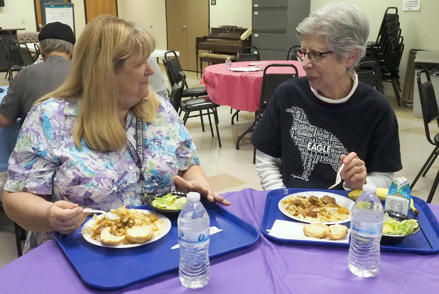 Loretta Block, 62, chats with Janice Schrumm, 74, during lunch at Holy Spirit Lutheran Church March 2. Jerry Henkel/View