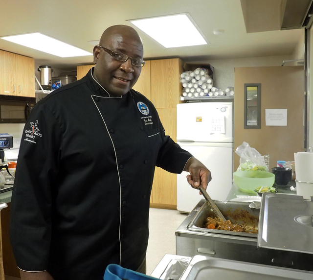 Jon Stokes, executive chef at the Culinary Academy of Las Vegas, shows off his school's beef stew, which was served for lunch at the Holy Spirit Lutheran Church March 2. Jerry Henkel/View