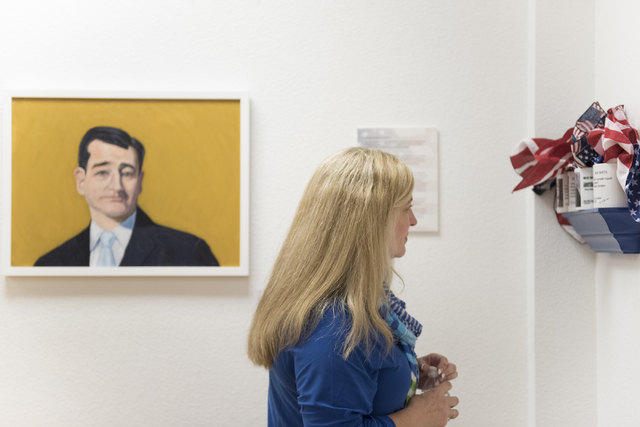 Kathy Heintz views the "MUG SHOTS #3" group show at Left of Center Art Gallery, 2207 W. Gowan Road in North Las Vegas, March 12. Jason Ogulnik/View