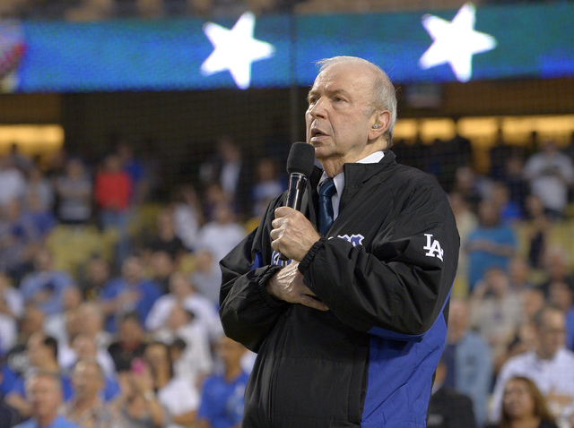 In this Sept. 18, 2015, file photo, Frank Sinatra, Jr. sings the national anthem prior to a baseball game between the Los Angeles Dodgers and the Pittsburgh Pirates in Los Angeles. Sinatra Jr., wh ...