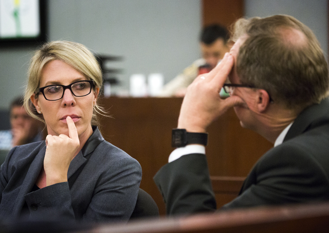 Prosecutors Michelle Fleck,left,  and Frank Coumou confer during the sentencing of Michelle Paet at Regional Justice Center on Thursday, March 3, 2016. Paet received life in prison for killing her ...