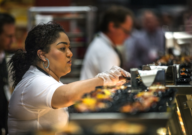 Amber Anderson serves Fontanini pizza during  the Pizza Expo at the Las Vegas Convention Center on Tuesday, March 8, 2016. Jeff Scheid/Las Vegas Review-Journal Follow @jlscheid