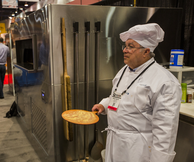 Pizza maker Marty Bacon waits for a crust in the ProLuxe booth during the Pizza Expo at  the Las Vegas Convention Center on Tuesday, March 8, 2016. Jeff Scheid/Las Vegas Review-Journal Follow @jls ...