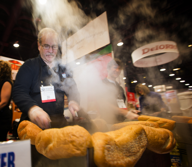 Carl Scheifele makes Philadelphia style chicken cheesesteaks at the Charles Ritter booth during the Pizza Expo at the Las Vegas Convention Center on Tuesday, March 8, 2016. Jeff Scheid/Las Vegas R ...