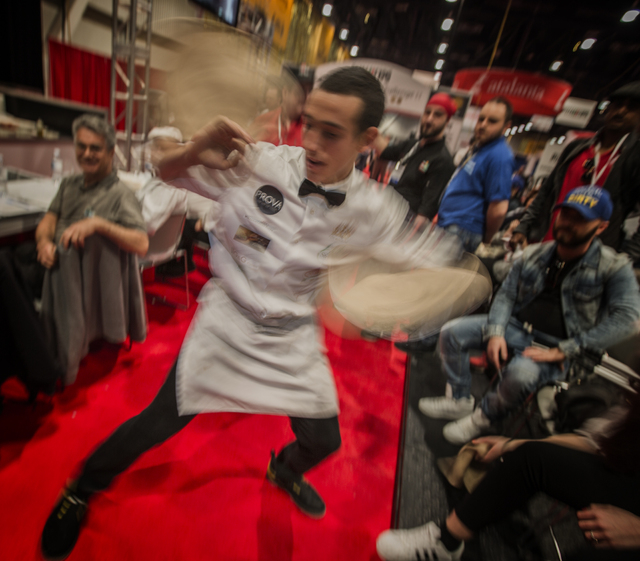 Scott Volpe with Fiamme Pizza Napoletana in Tucson, Ariz. spins rubber pizza crusts during the Pizza Expo at the Las Vegas Convention Center on Tuesday, March 8, 2016. Jeff Scheid/Las Vegas Review ...