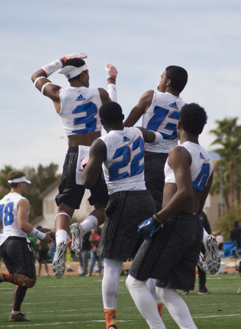 702 Elite celebrates an interception during their game against TNT during the Pylon Elite 7v7 Las Vegas National football tournament at All American Park in Las Vegas on Saturday, March 5, 2016. 7 ...