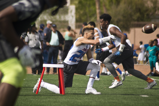 702 Elite's Tyjon Lindsey (25) snaps the ball from a specialized podium during their game against Ground Zero during the Pylon Elite 7v7 Las Vegas National football tournament at All American Park ...