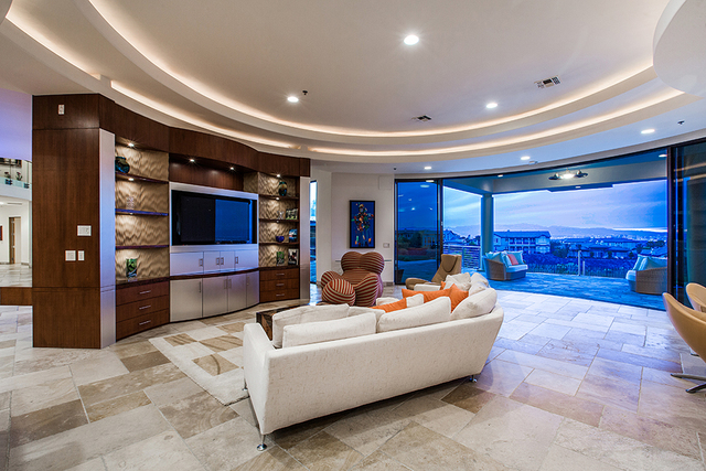 The living room opens onto a patio. (COURTESY OF Shapiro & Sher Group)