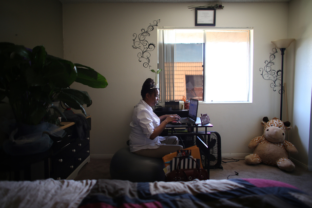Lateefa Starks works on homework at her home Wednesday, March 9, 2016. Rachel Aston/las Vegas Review-Journal Follow @rookie__Rae