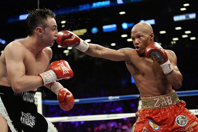 Dec 7, 2013; Brooklyn, NY, USA; Zab Judah (red trunks) and Paulie Malignaggi (black trunks) box during their NABF Welterweight Title bout at Barclays Center. Malignaggi won via unanimous decision. ...
