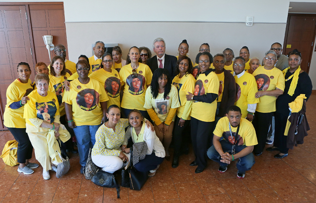 Friends and family of Jamey Walker pose for a personal photo in the hallway after the sentencing of Willie Shannon at Regional Justice Center Thursday, March 10, 2016, in Las Vegas. Shannon was se ...