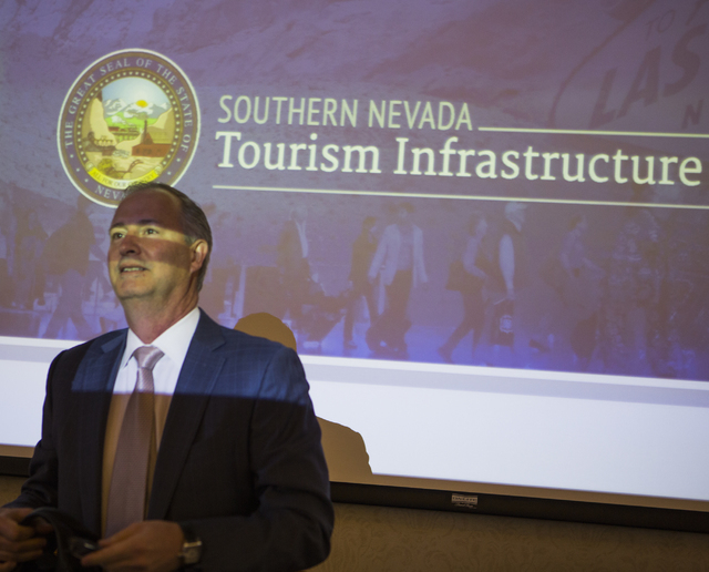 Steve Hill, chairman of the Southern Nevada Tourism Infrastructure Committee, stands in front of a video screen before the board met to discuss the proposed new stadium at UNLV on Thursday, March  ...