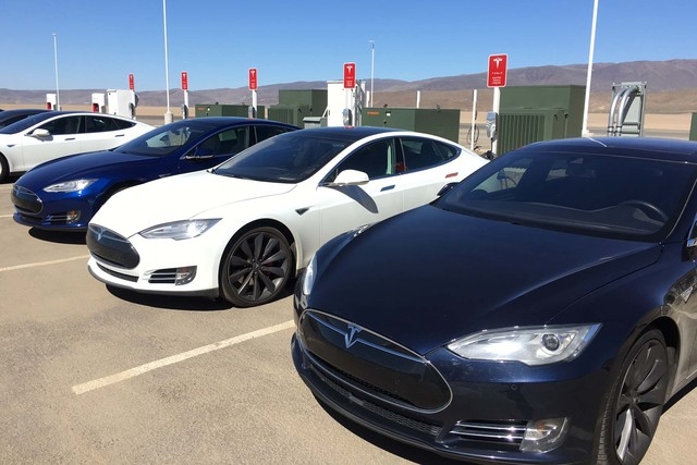 Tesla vehicles parked outside the Tesla Gigafactory east of Reno on Friday, March 18, 2016. (Sean Whaley/Las Vegas Review-Journal Capital Bureau)