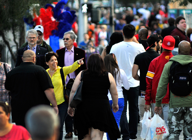 Tourists walk along the Strip in front of the New York New York hotel-casino in Las Vegas on Thursday, Feb. 26, 2015. David Becker/Las Vegas Review-Journal