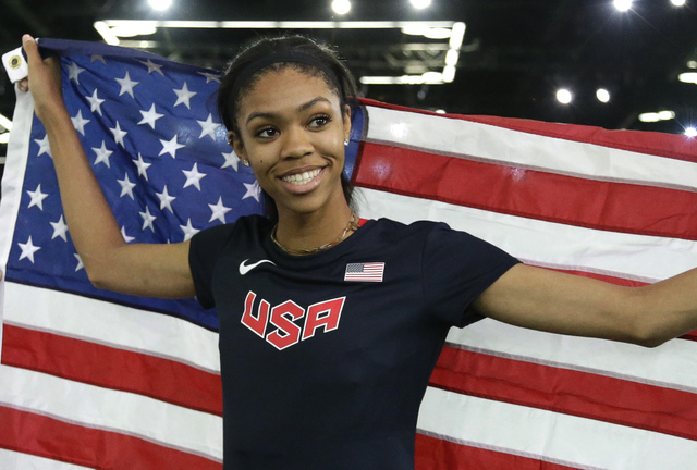 United States' Vashti Cunningham hold the U.S. flag after she won the women's high jump final during the World Indoor Athletics Championships, Sunday, March 20, 2016, in Portland, Ore. Cunningham ...