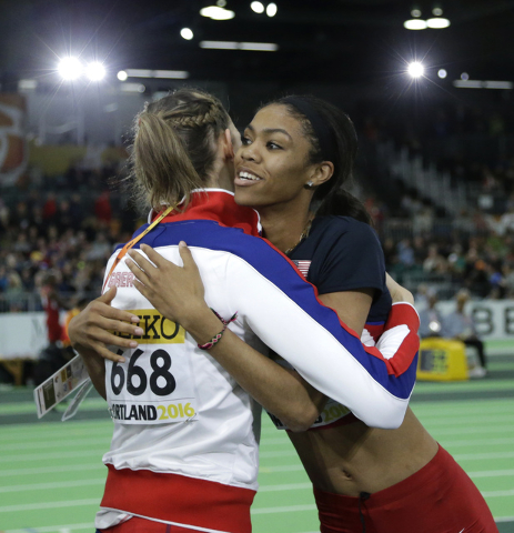 United States' Vashti Cunningham, right, is hugged by Britain's Isobel Pooley after Cunningham won the women's high jump final during the World Indoor Athletics Championships, Sunday, March 20, 20 ...