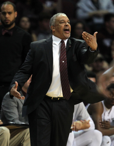 New Mexico State coach Marvin Menzies talks to his team during the first half of an NCAA college basketball game against Cal State Bakersfield in the finals of the Western Athletic Conference men' ...