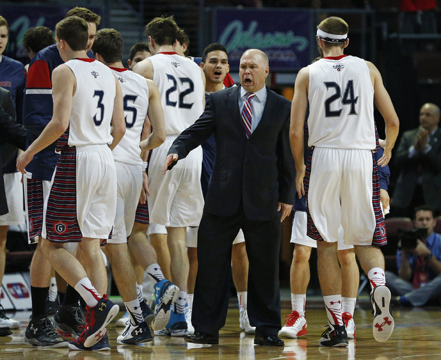 Saint Mary's head coach Randy Bennett, center right, yells at his team during the first half of a West Coast Conference tournament NCAA college basketball game against Pepperdine Monday, March 7,  ...