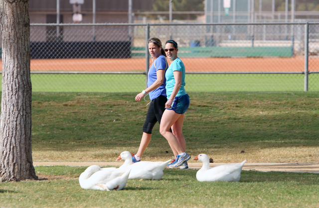 Kerrie Cathcart, left, and her sister Kim Howell walk on a sunny morning at Sunset Park Monday, March, 14, 2016, in Las Vegas. The Las Vegas Valley can expect to see sunny skies and warm temperatu ...