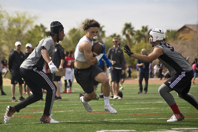 702 Elite's Ethan Dedeaux (2) runs the ball up the field during their game against TNT during the Pylon Elite 7v7 Las Vegas National football tournament at All American Park in Las Vegas on Saturd ...
