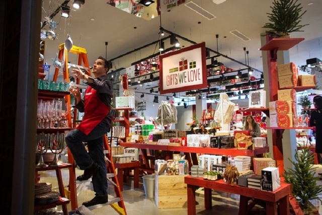 David Henault (cq) finishes hanging a display inside The Tree Lot at Crate and Barrel, a temporary holiday store by the retailer, Tuesday, Oct. 29, 2013 at Town Square. The "pop-up shop" will be o ...