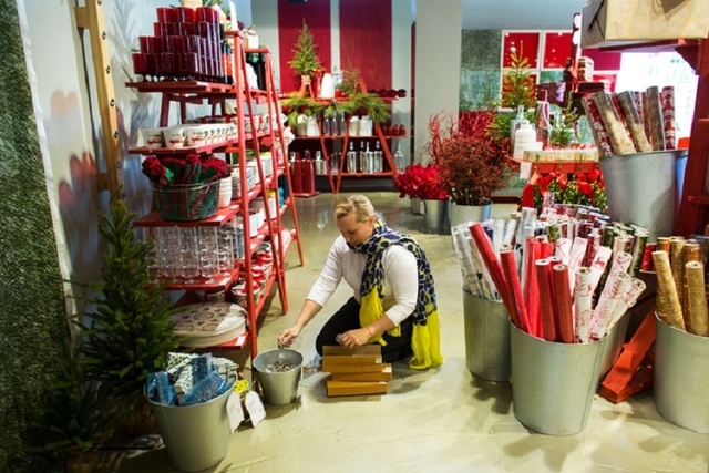Gretchen Zuk (cq) stocks jingle bell napkin rings inside The Tree Lot at Crate and Barrel, a temporary holiday store by the retailer, Tuesday, Oct. 29, 2013 at Town Square. (Samantha Clemens/Las V ...